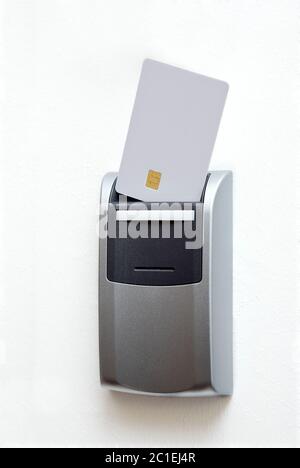chipcard reader on white wall Stock Photo