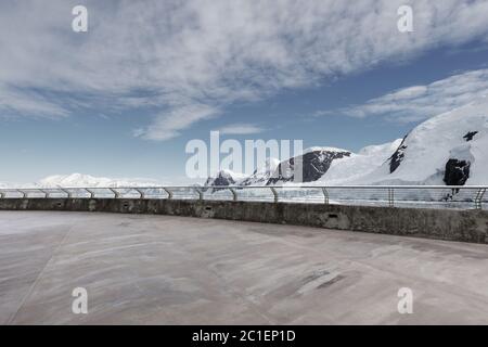 empty brick ground with sonw mountain as background Stock Photo