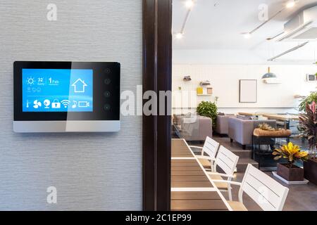 smart home app in control panel in modern restaurant Stock Photo