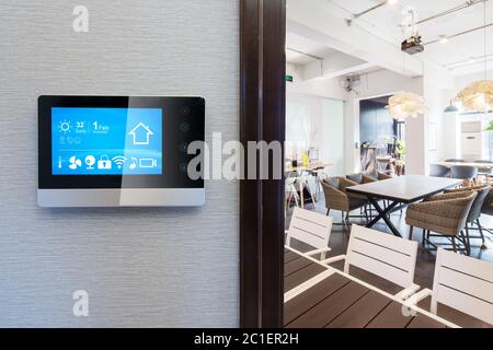 smart home app in control panel in modern restaurant Stock Photo