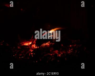 Burning charcoal, Fire, Flame at night. Stock Photo