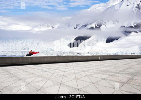 empty brick ground with sonw mountain as background Stock Photo