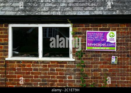 Save Capel campaign poster in village of Tudeley protesting against plan by Tunbridge Wells Borough Council to build over 4,000 houses in Tudeley and Capel in next few years in a 'garden village' development. Locals say the project, which is on designated Green Belt land, is far in excess of what the rural Capel parish and its infrastructure can cope with. The area is also on the edge of the Medway Valley and in a high risk flood zone. Similar large new housing developments are also planned for nearby Five Oak Green and Paddock Wood. Kent, England Stock Photo