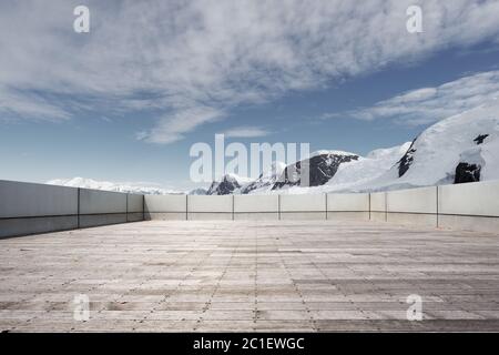 empty brick ground with sonw mountain as background Stock Photo