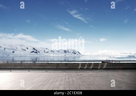 empty brick ground with sonw mountain as background Stock Photo