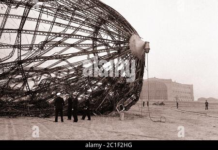 Members of the U.S. Navy Commission of inquiry examine the wreck of the Hindenburg on a field in new Jersey, may 8, 1937. Stock Photo
