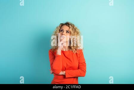 Confused woman have to choose something. concept of options, confusion, decision. Stock Photo