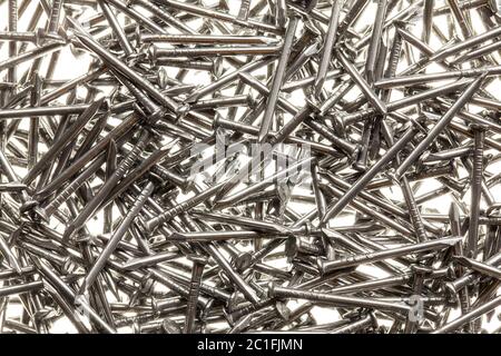 Many steel nails on white background Stock Photo