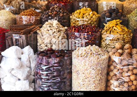 Spices and herbs being sold on street stall at arab traditional market Stock Photo