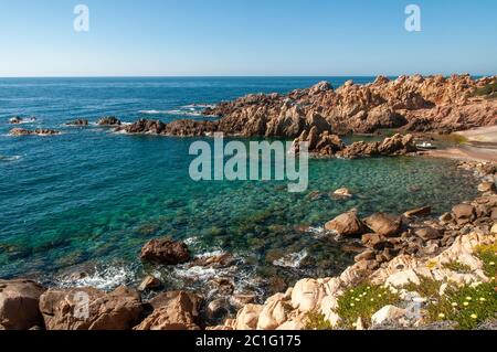 Rock pink granitic formation at Costa Paradiso beach in Sardinia Italy with turquoise blue sea Stock Photo