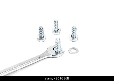 Spanners and screw nuts isolated on white background. Selective focus. Stock Photo