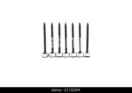 Black screws with sinver nuts isolated on white background. High quality photo Stock Photo