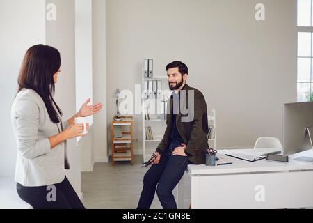 Business people talking in a white office. Stock Photo