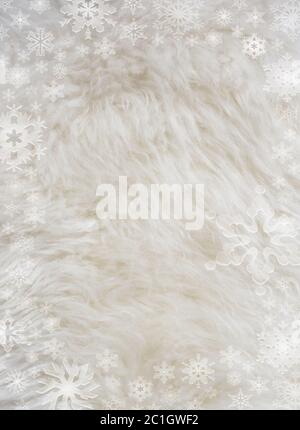 Fluffy white furry sheepskin and snowflakes Stock Photo