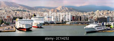Pireus, Greece - September 8, 2014: Big ferries boats in the passenger port of Piraeus, Athens, Greece. Stock Photo