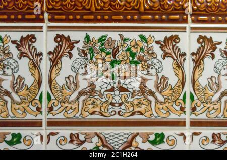Typical decoration of the facade of the house in Lisbon. Traditional ceramic tiles Azulejos Stock Photo