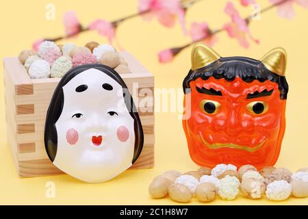 Japanese traditional event, soybean snacks and mask are used on an annual event /Setsubun. Stock Photo