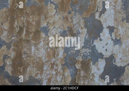 Plastered concrete wall with dirty water drips and peeling blue paint, abstract texture for the background. Stock Photo