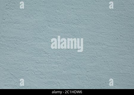 The texture of a roughly plastered wall with a bluish-dirty hue. Stock Photo