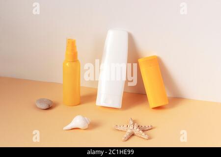 Cosmetics SPF for face and body, unbranded blank packages on yellow and white background. Isometric View Stock Photo