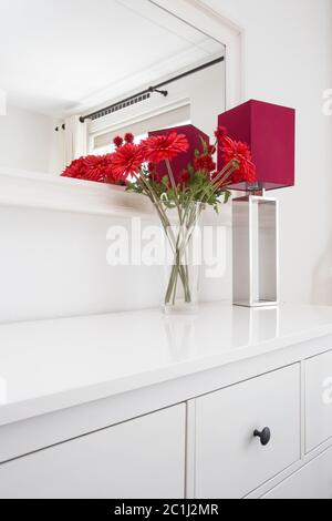 Modern lamp on the desk on white wall background Stock Photo - Alamy