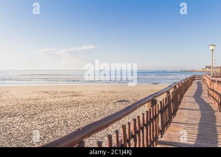 Board walk at the beach in the morning at sunrise - holiday background Stock Photo