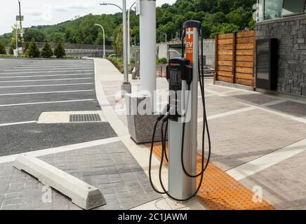 Tarrytown, NY - June 15, 2020: Electric vehicle charging station seen at Rockland landing of Mario Cuomo Bridge in Tarrytown. Stock Photo