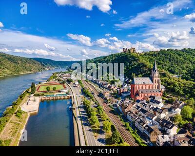 Aerial view on Oberwesel am Rhein. Small town on the upper middle Rhine River, Mittelrhein. Beautiful panoramic Postcard with blue sky, clouds. Rhinel Stock Photo