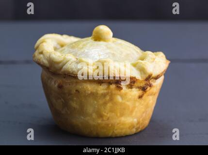 Rustic home made pie close up with selective focus on black table