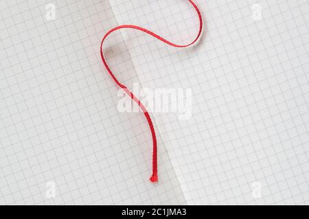 Page for notebook, squared notebook and red bookmark, background for design Stock Photo