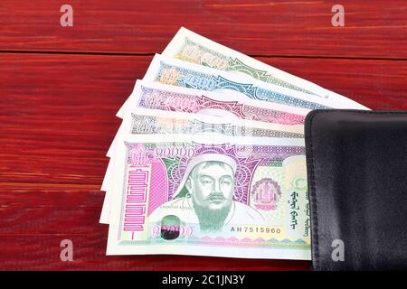 Mongolian Tugrik in the black wallet Stock Photo