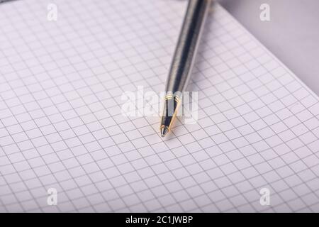 pen on a notebook close-up Stock Photo