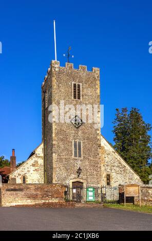 The Norman medieval St Mary's Church against blue sky in Buriton in the South Downs National Park, Hampshire, England, UK Stock Photo