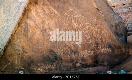 elephant and men- Cave paintings and petroglyphs at Boumediene ,Tassili nAjjer national park, Algeria Stock Photo