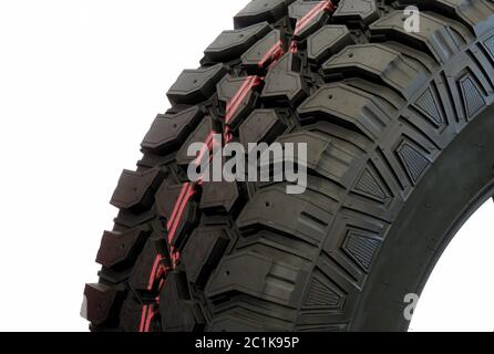 Treads of the modern off road mud tire isolated close up Stock Photo