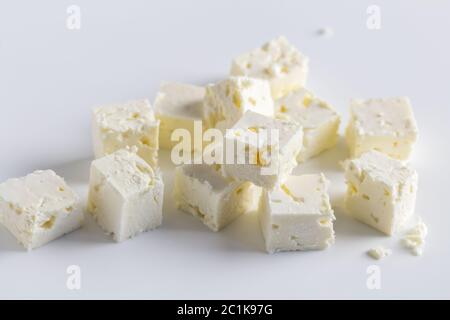 Feta cheese diced on white background Stock Photo