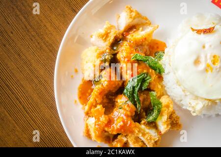 Rice with crispy chicken and fried egg Stock Photo