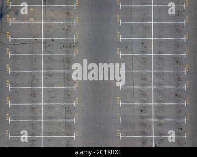 Asphalt floor with parking lot at city center, vacant parking lot. Parking lane painting on floor with numbered places. Stock Photo