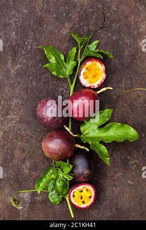 Passion fruits with leaves. Passiflora edulis Stock Photo