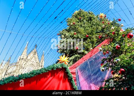 Festive Christmas market in Cologne takes place in a fantastic location in front of the Cologne Cathedral, Germany Stock Photo