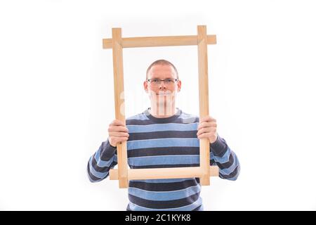 Man holds frame Stock Photo