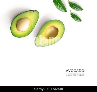 Creative layout made of avocado and leaves. Flat lay. Food concept. Avocado on white background. Stock Photo