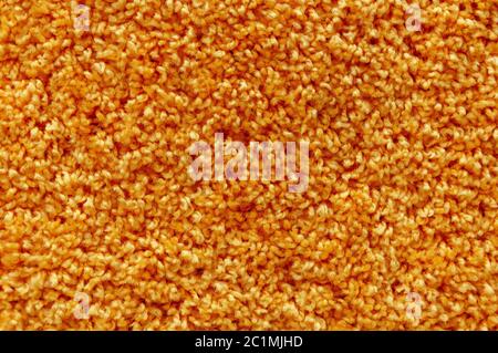 Orange wool carpet texture. Abstract background Stock Photo