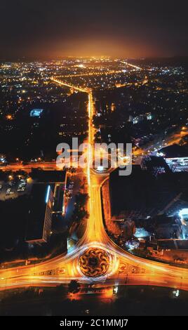 Night city on long exposure. Night roads with rings in a small town in the North Caucasus. Russia Stock Photo