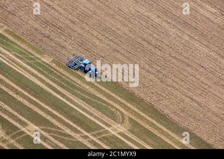 Tractor working on a field Stock Photo