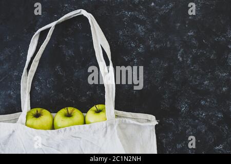 reusable grocery bag with green apples in it, concept of buying fresh organic ingredients Stock Photo