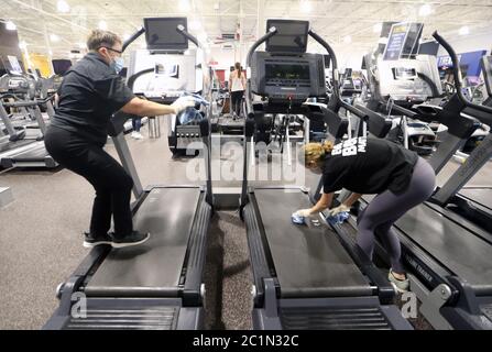 Maplewood United States 15th June Club Fitness Gym Employee David Watts Uses A Electro Magnetic Sprayer To Clean A Fitness Machine After Use On Day One Of Their Reopening In Maplewood