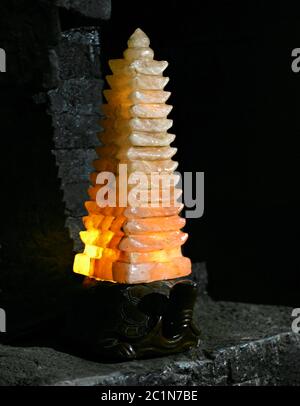 Glowing stone lamp in a Buddhist temple Stock Photo