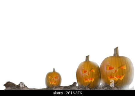 Halloween pumpkin head jack lantern with burning candles isolated on white background Stock Photo
