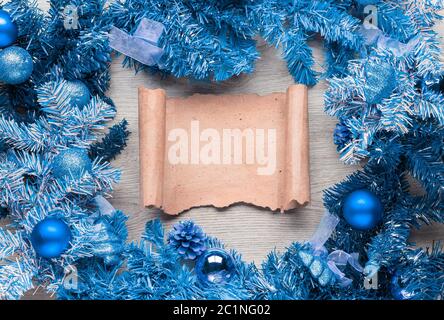 christmas wreath with parchment on wood Stock Photo